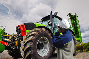 mechanic, farmer with large tractor, latest model Royalty-Free Stock ...