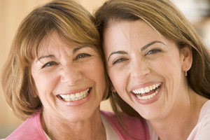 Two women in living room smiling Royalty-Free Stock Photo SBI-301056028 ...