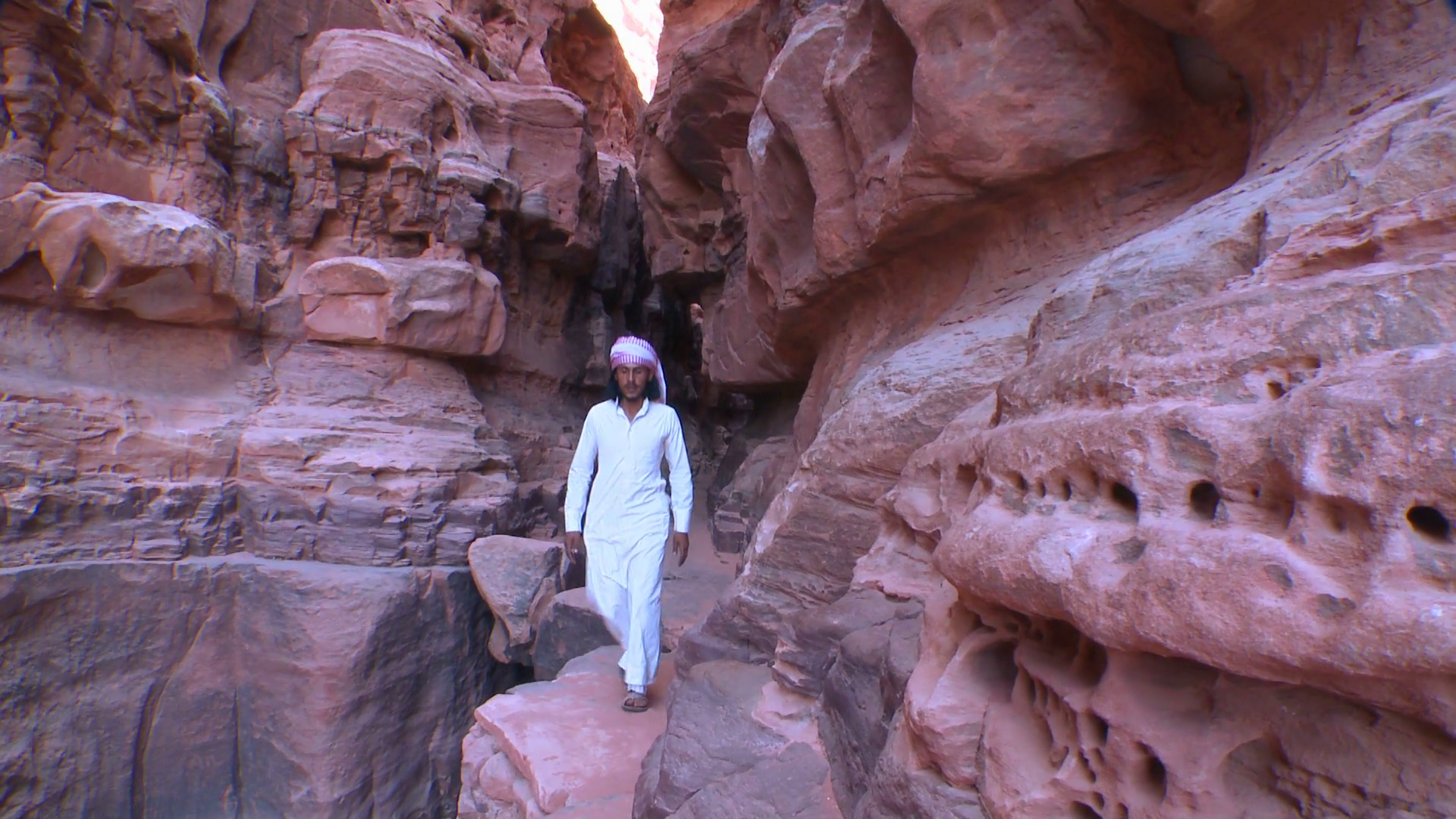 An Arab Man Walks Along Narrow Ledge In Stock Footage SBV-307867008 ...