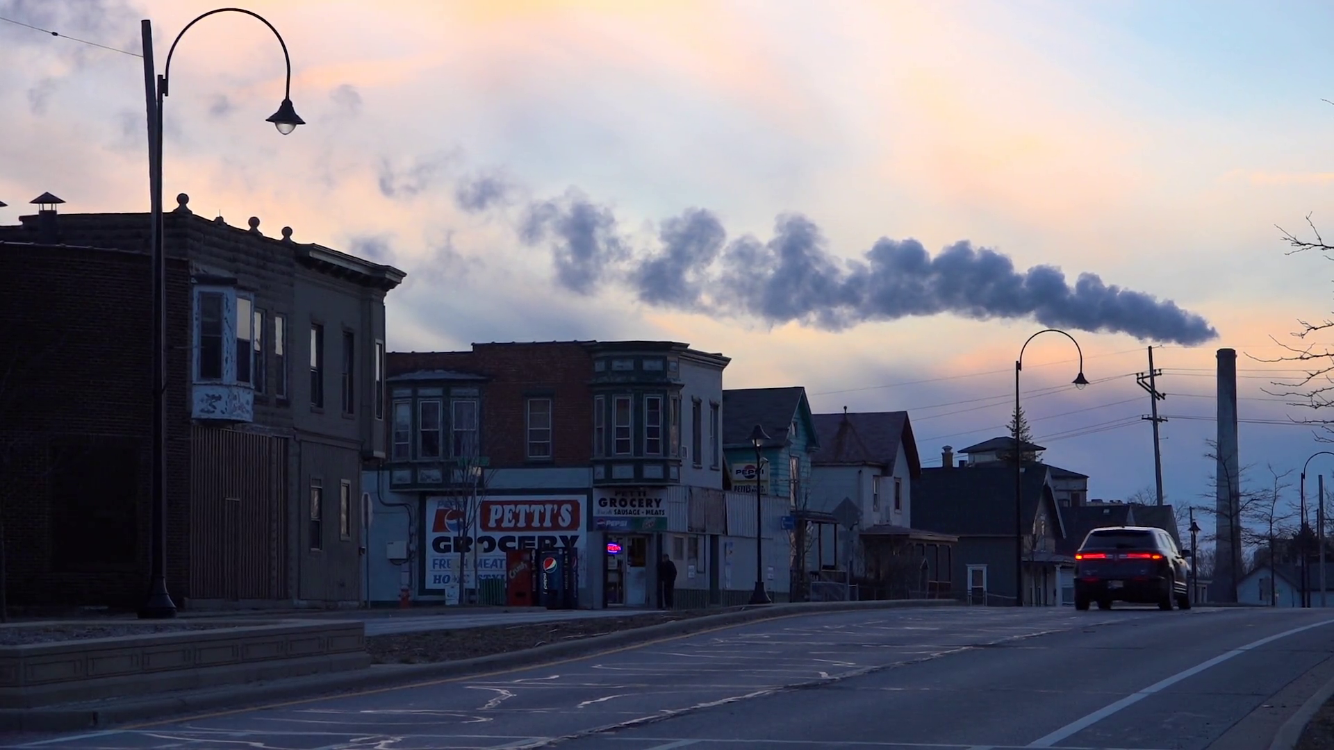 A Smokestack Belches Pollution Over Michigan Stock Footage SBV ...