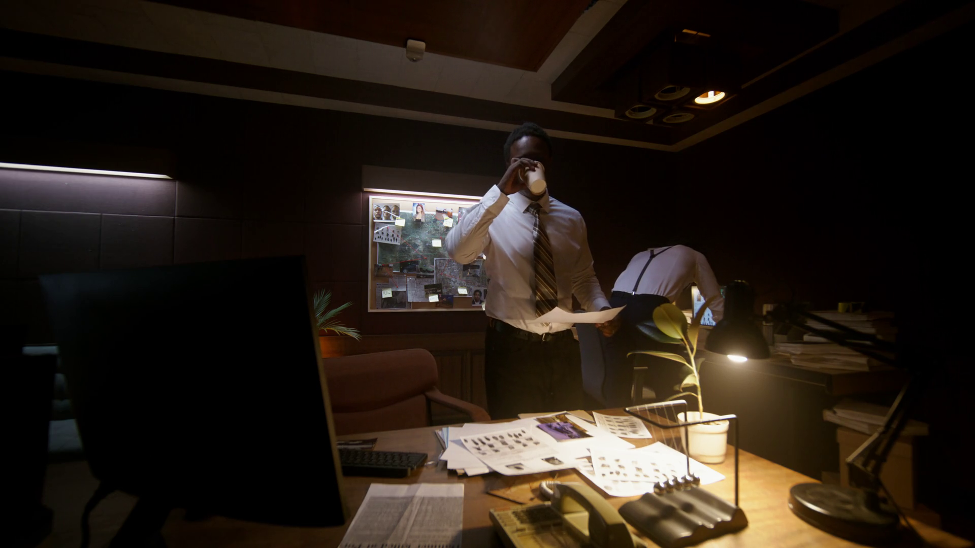 Two Detectives Look At Evidence Photographs Stock Footage SBV-352100257 ...