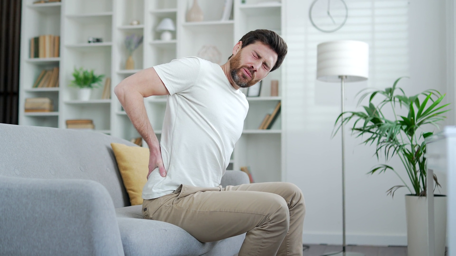 Tired Man Suffering From Back Pain Sitting Stock Footage SBV-352016002 ...