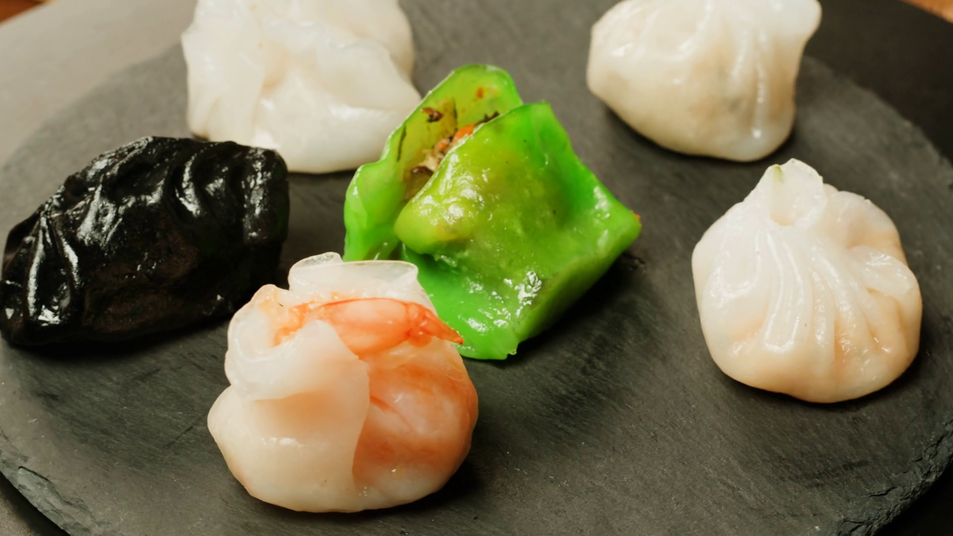Various Of Colored Dim Sum On Black Plate Stock Footage SBV-348707941 ...