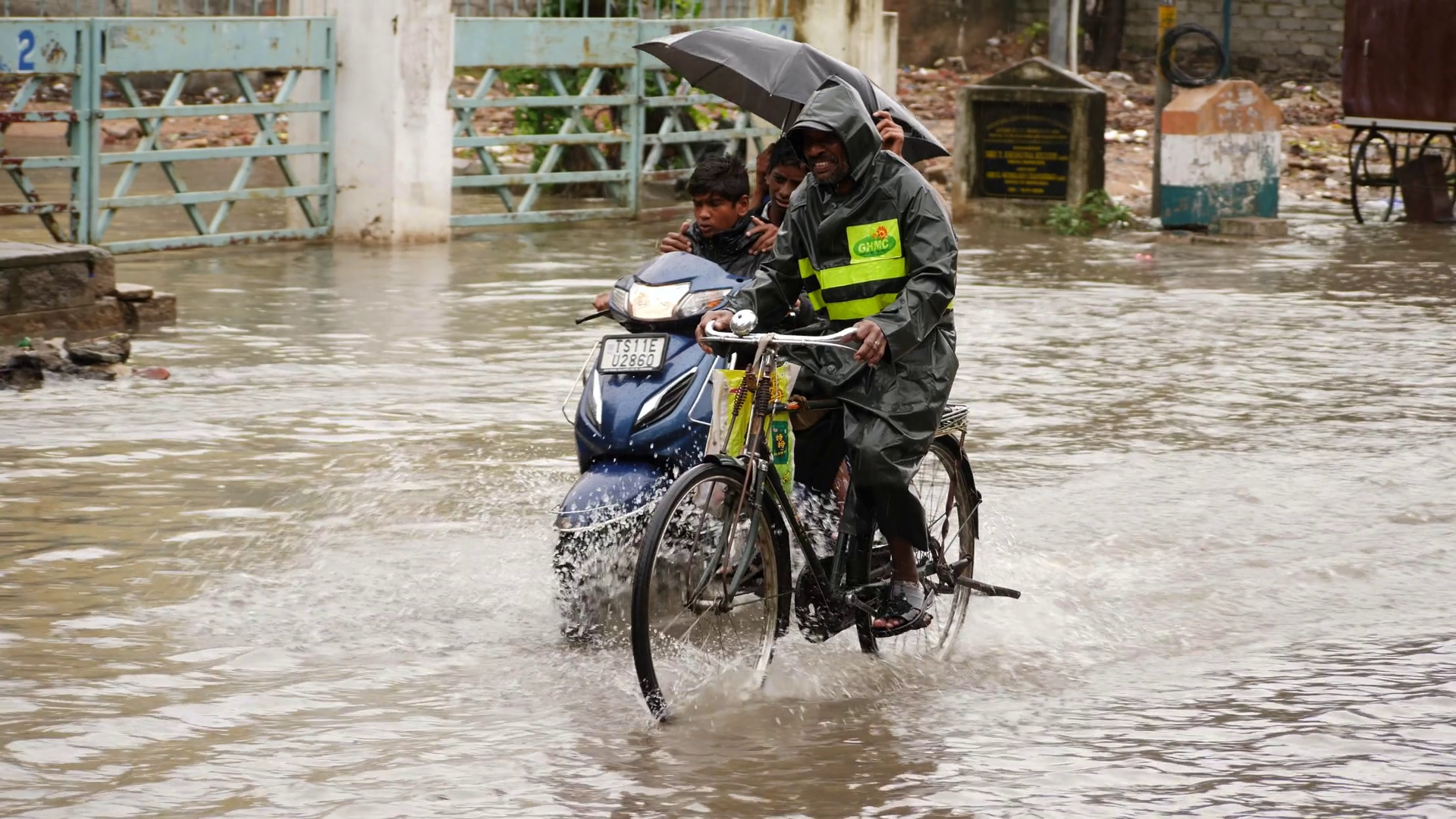 A Man Cycles With People On Flooded Street Stock Footage SBV-348365042 ...