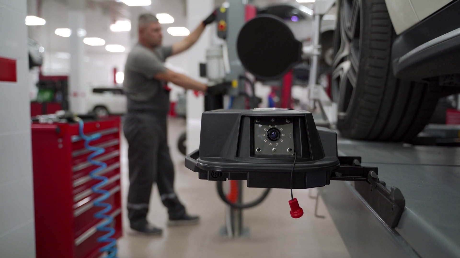 Auto Technician Aligns Car Tire With High Stock Footage SBV-348963739 ...