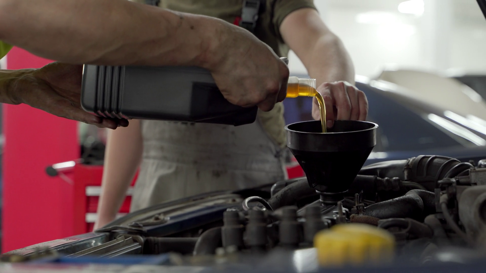 Auto Mechanic Pours Fresh Motor Oil Into Stock Footage SBV-348938361 ...