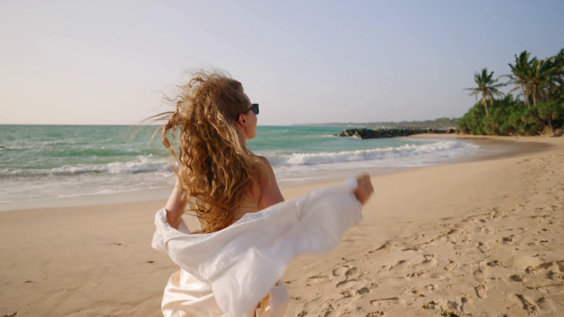 Young Woman Running Turning Back At Sandy Stock Footage SBV-348820572 ...