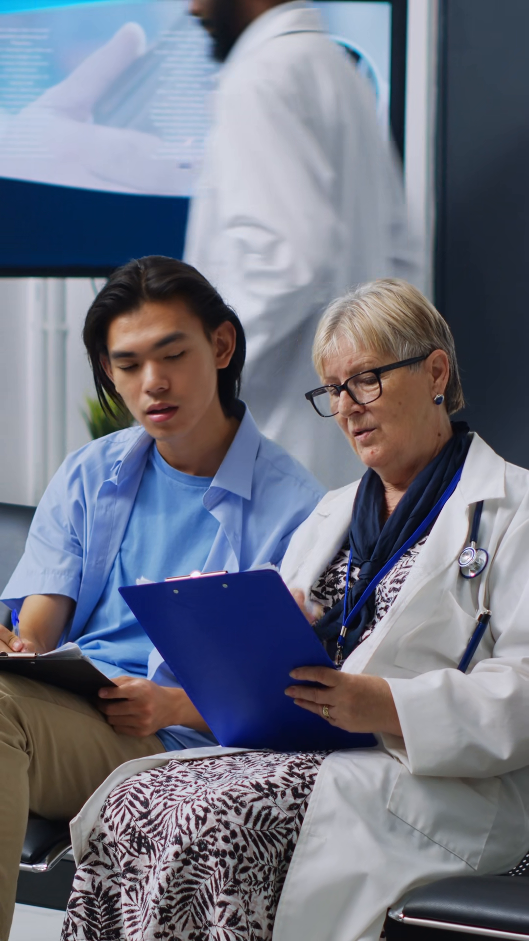 Vertical Video: Doctor Helping Patient To Stock Footage SBV-353653449 ...
