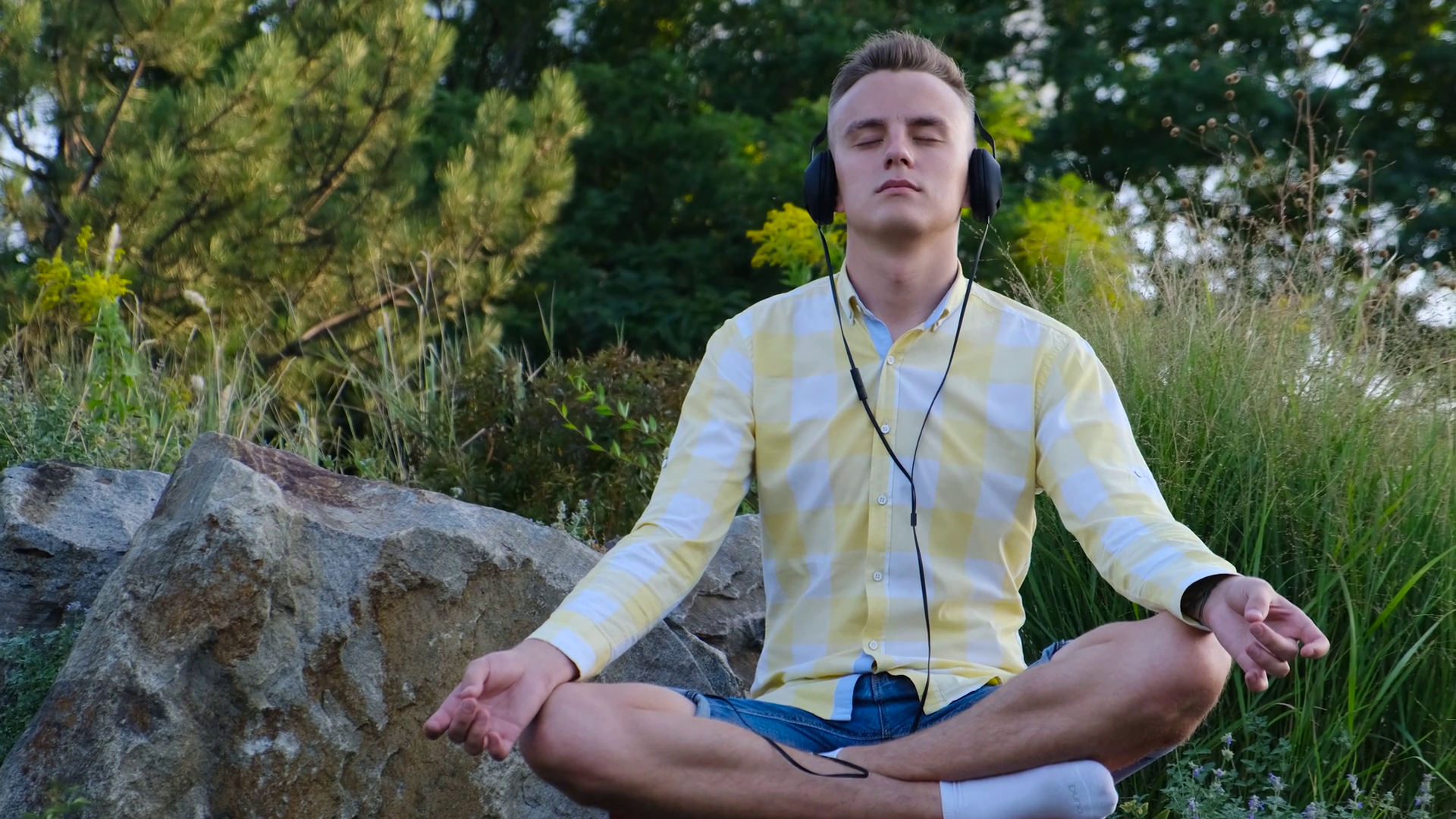 The Guy Is Meditating Listening To Music On Stock Footage SBV-337508703 ...