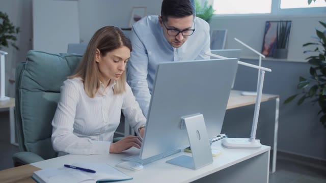 Helping Coworker Stock Footage: Royalty-Free Video Clips - Storyblocks