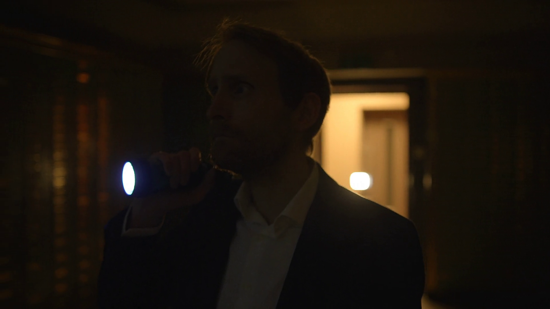 Man With Flashlight Standing In Dimly Lit Stock Footage SBV-349055059 ...