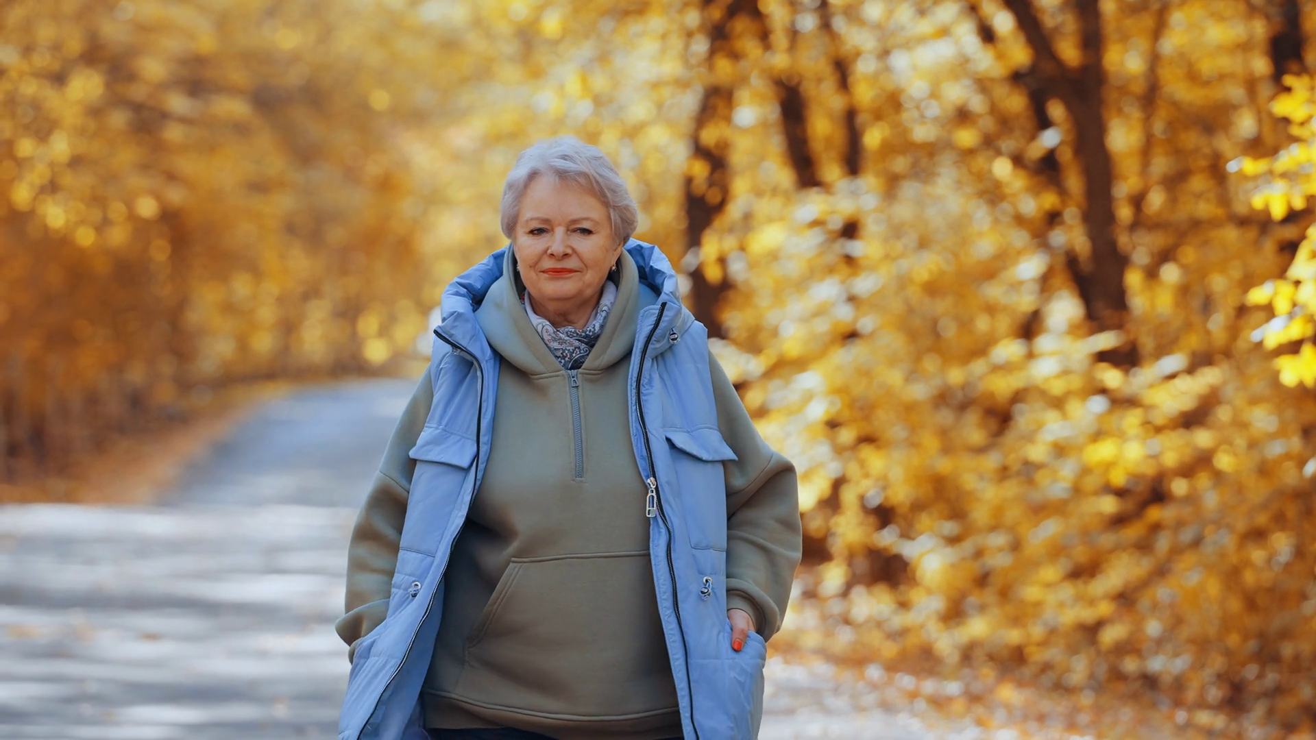Senior Woman Walking In Park In Autumn Stock Footage SBV-348641517 ...
