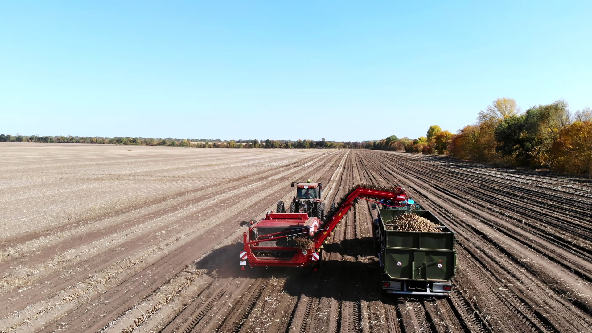 Birds-eye View Of Potato Harvester Unloading Stock Footage SBV ...