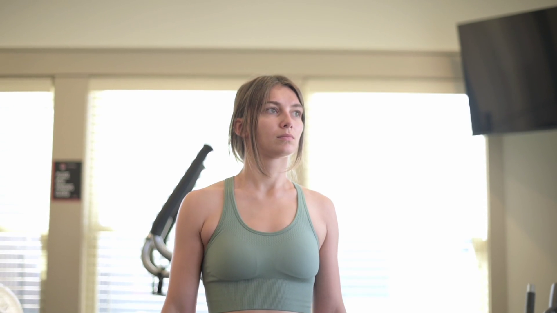 Focused Young Woman In Green Sports Bra Stock Footage SBV-352007654 ...