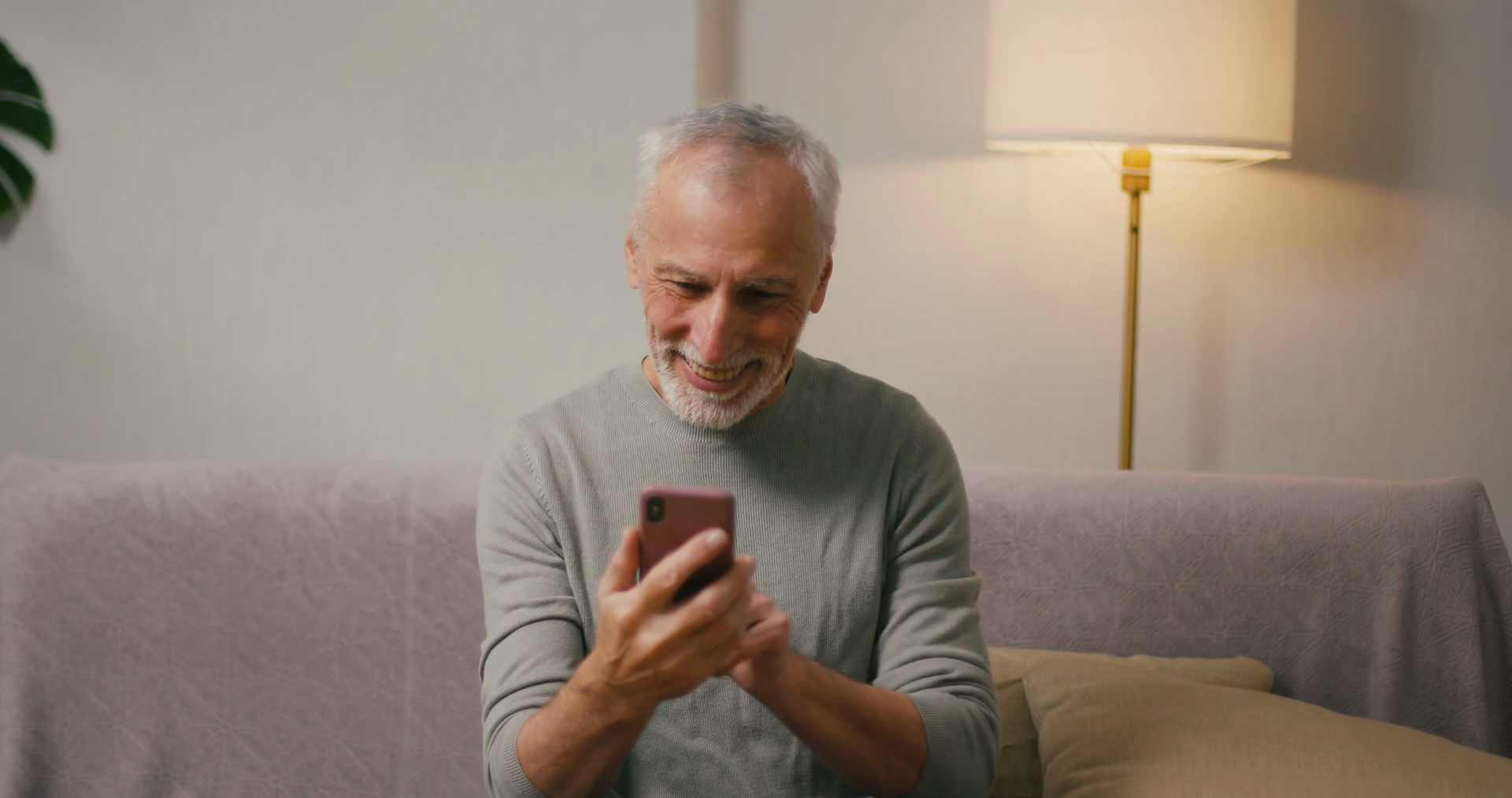 Happy Mature Man Reads Message On Smartphone Stock Footage SBV ...