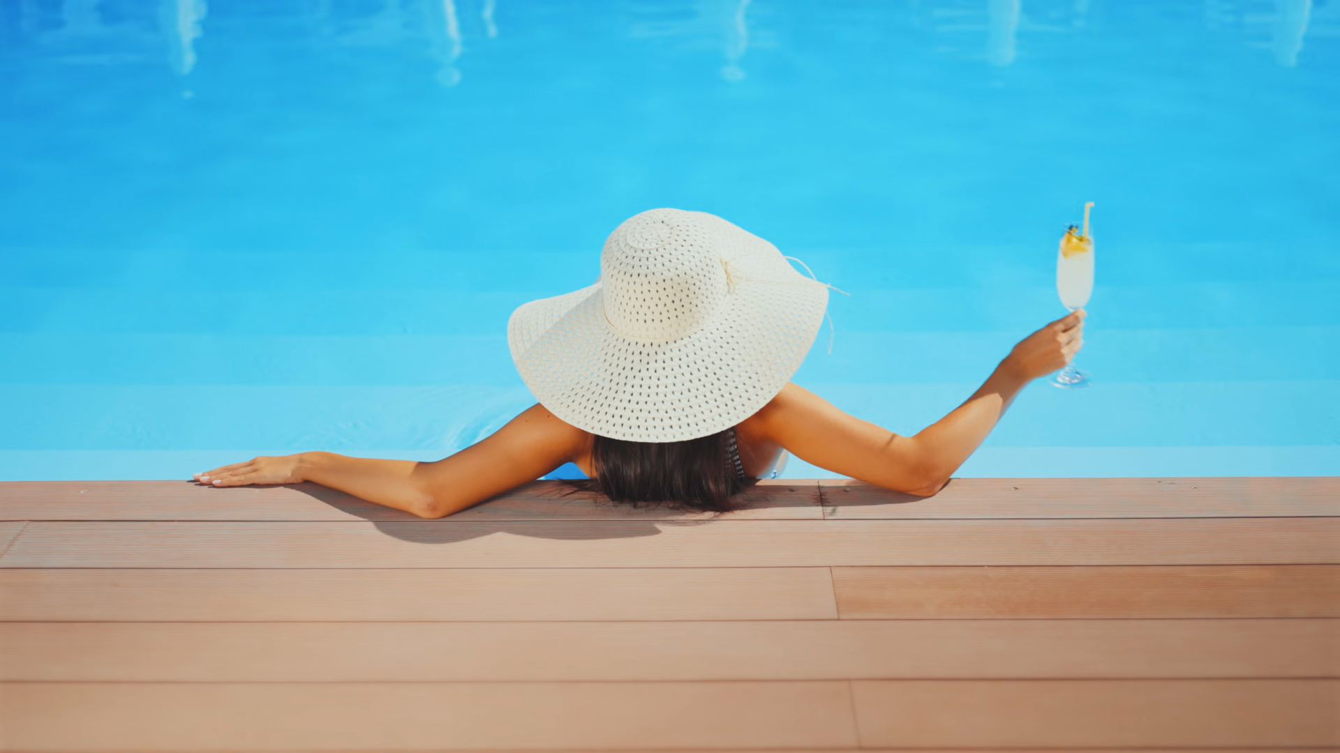Woman In Sun Hat Relaxing At Poolside With Stock Footage SBV-354144355 ...