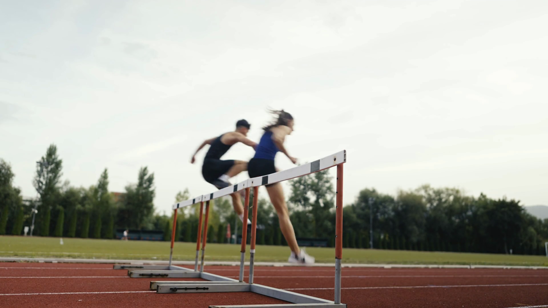 Athletic Fit Couple Man Woman Hurdling In Stock Footage SBV-349393854 ...