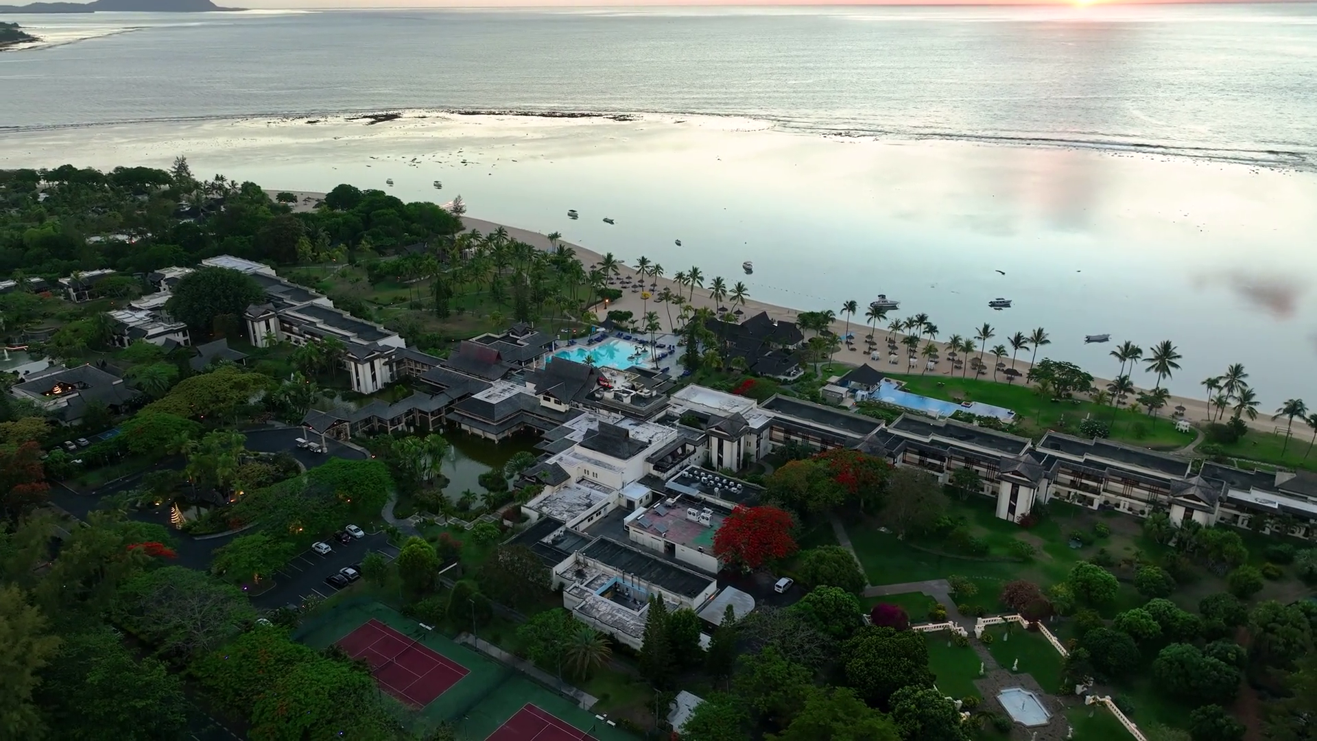 Aerial Video Of Beachfront Resort Sunrise Stock Footage SBV-352110206 ...