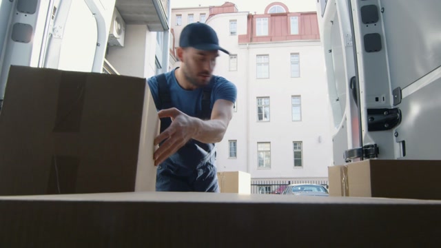 Delivery Man Unloading Stock Footage: Royalty-Free Video Clips ...