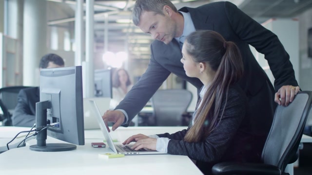 Team Leader Tapping Employee Stock Footage: Royalty-Free Video Clips ...