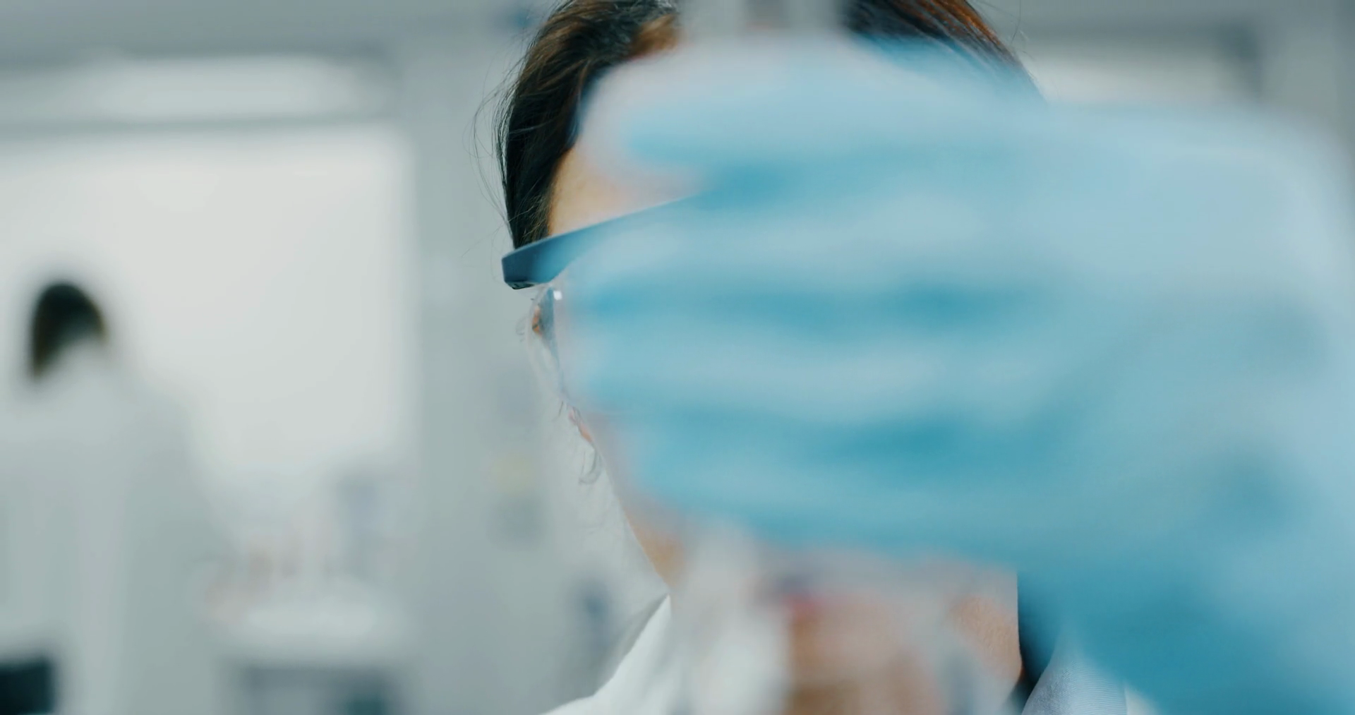 A Female Scientist In Safety Goggles Gloves Stock Footage SBV-348978889 ...