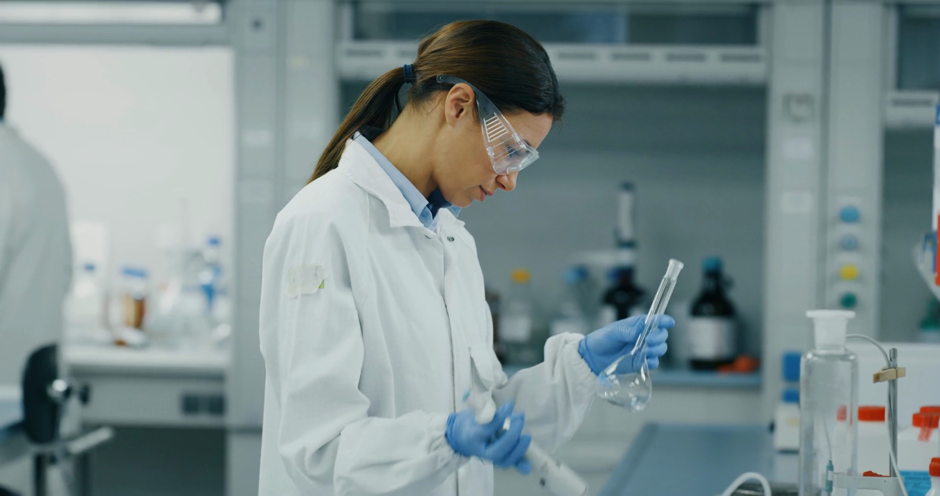 A Female Scientist In White Lab Coat Safety Stock Footage SBV-348978973 ...