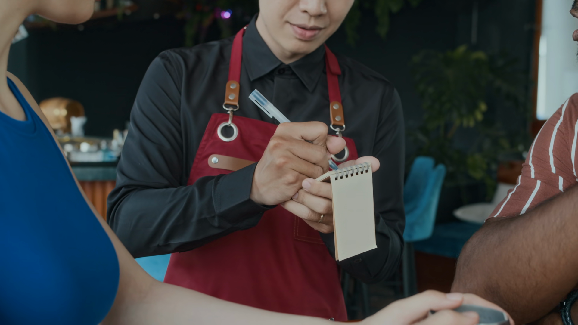 Tilt Down Shot Of Asian Waiter Making Notes Stock Footage SBV-354287555 ...