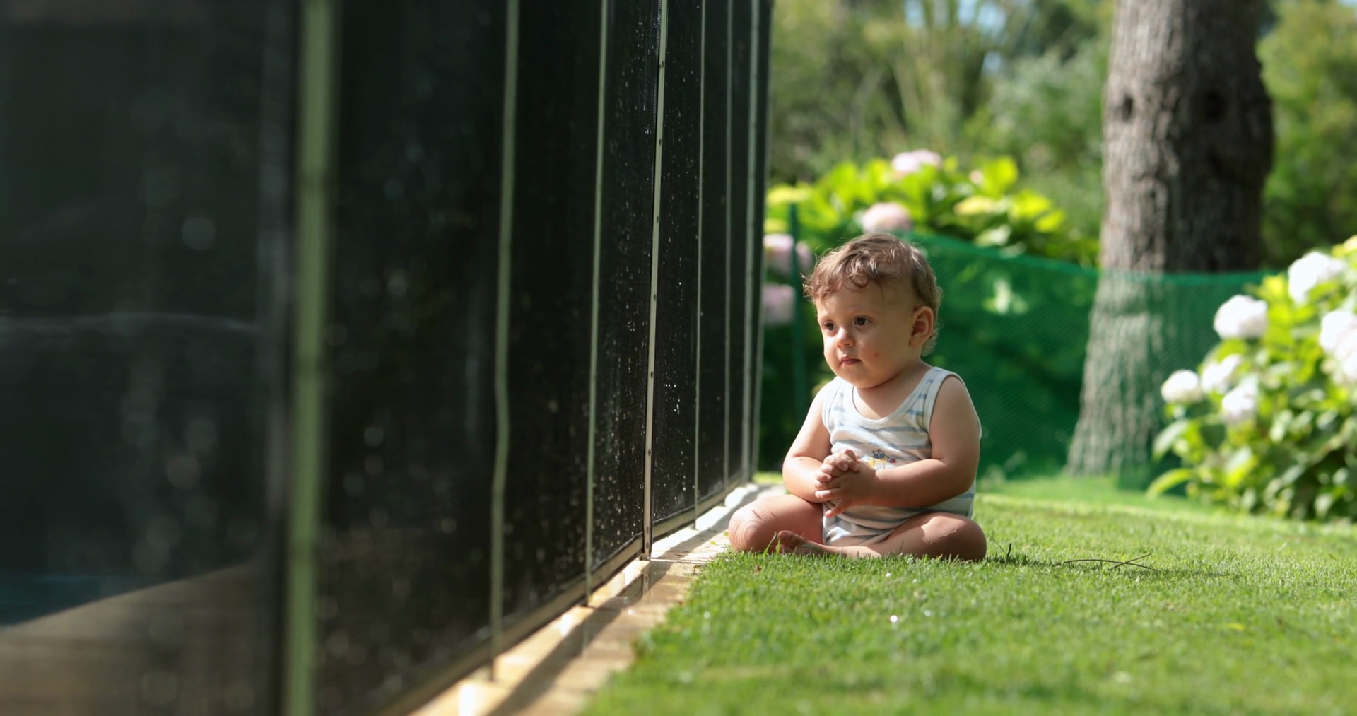 Contemplative Baby Sitting On Lawn Stock Footage SBV-349078028 ...
