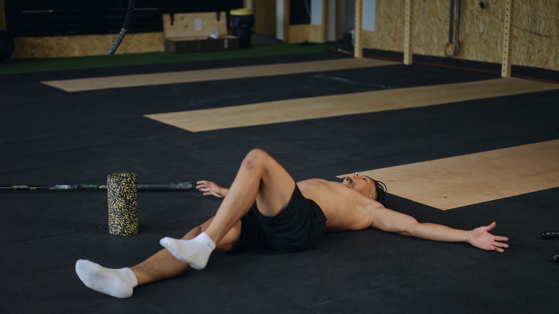 A Man Lies With Arms Outstretched On Floor Stock Footage SBV-348791093 ...