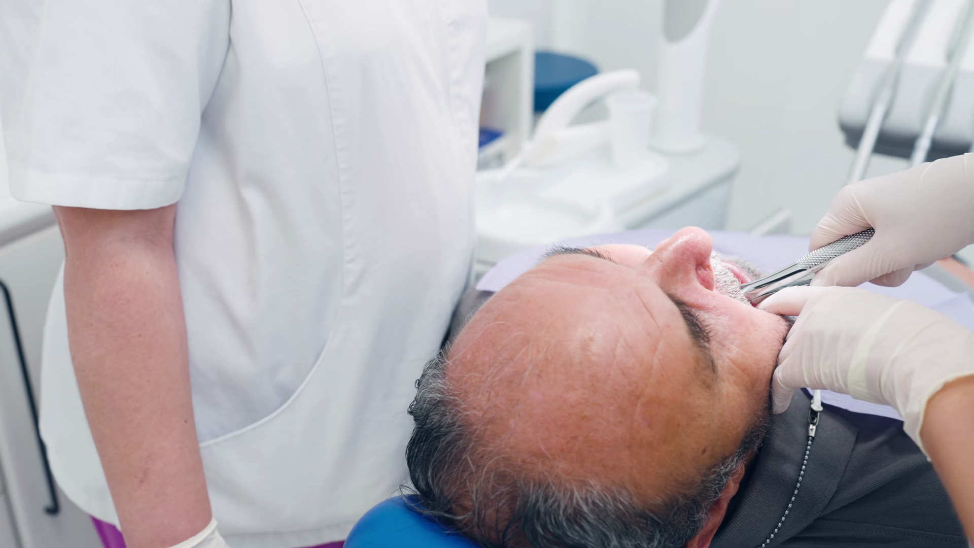 Dental Professional Using Forceps To Perform Stock Footage SBV ...