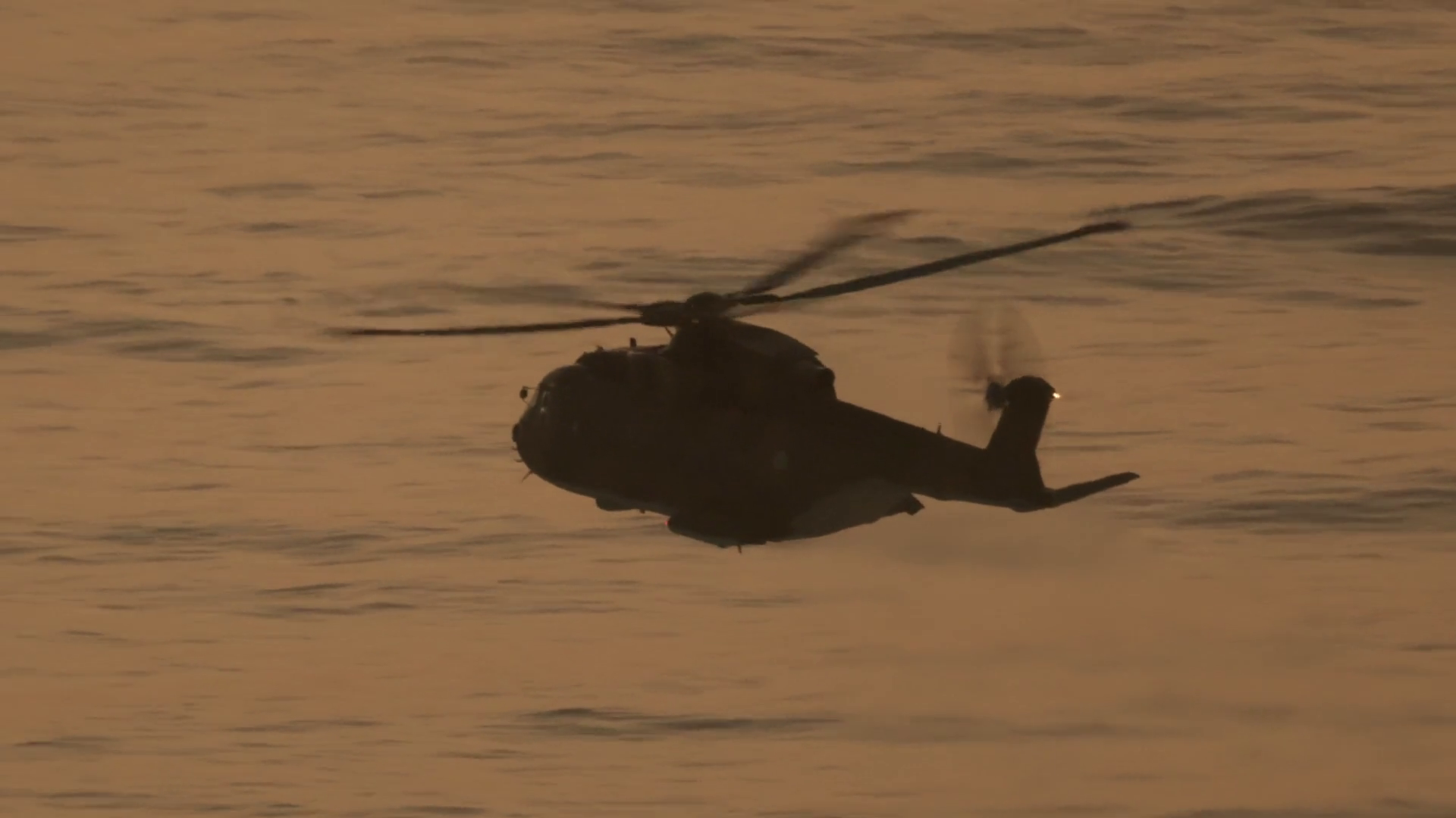 Military Helicopter Flying Over Ocean At Stock Footage SBV-352007514 ...