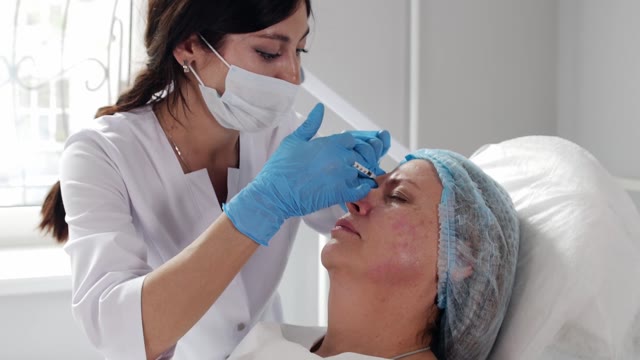 Mature Woman Injection Stock Footage: Royalty-Free Video Clips ...