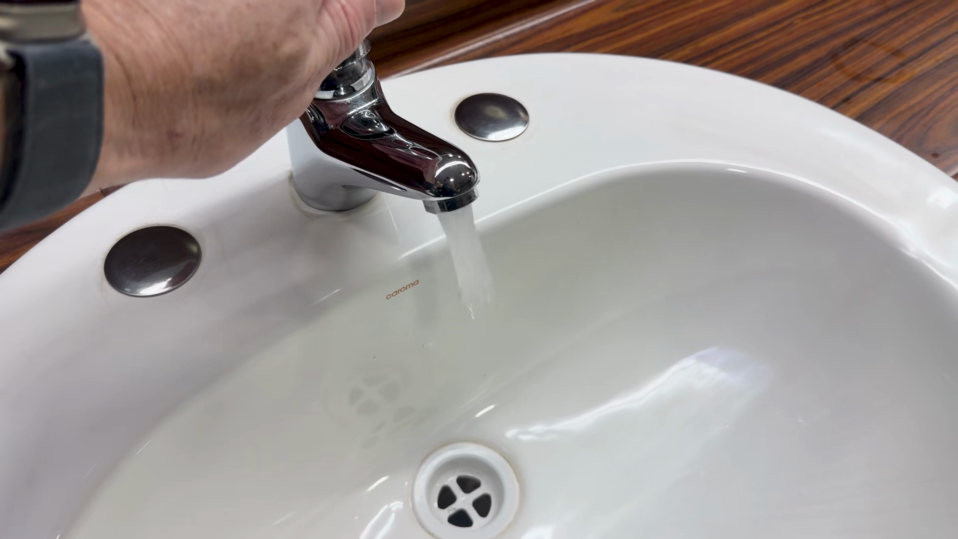 A Hand Turning On Off Chrome Bathroom Faucet Stock Footage SBV ...