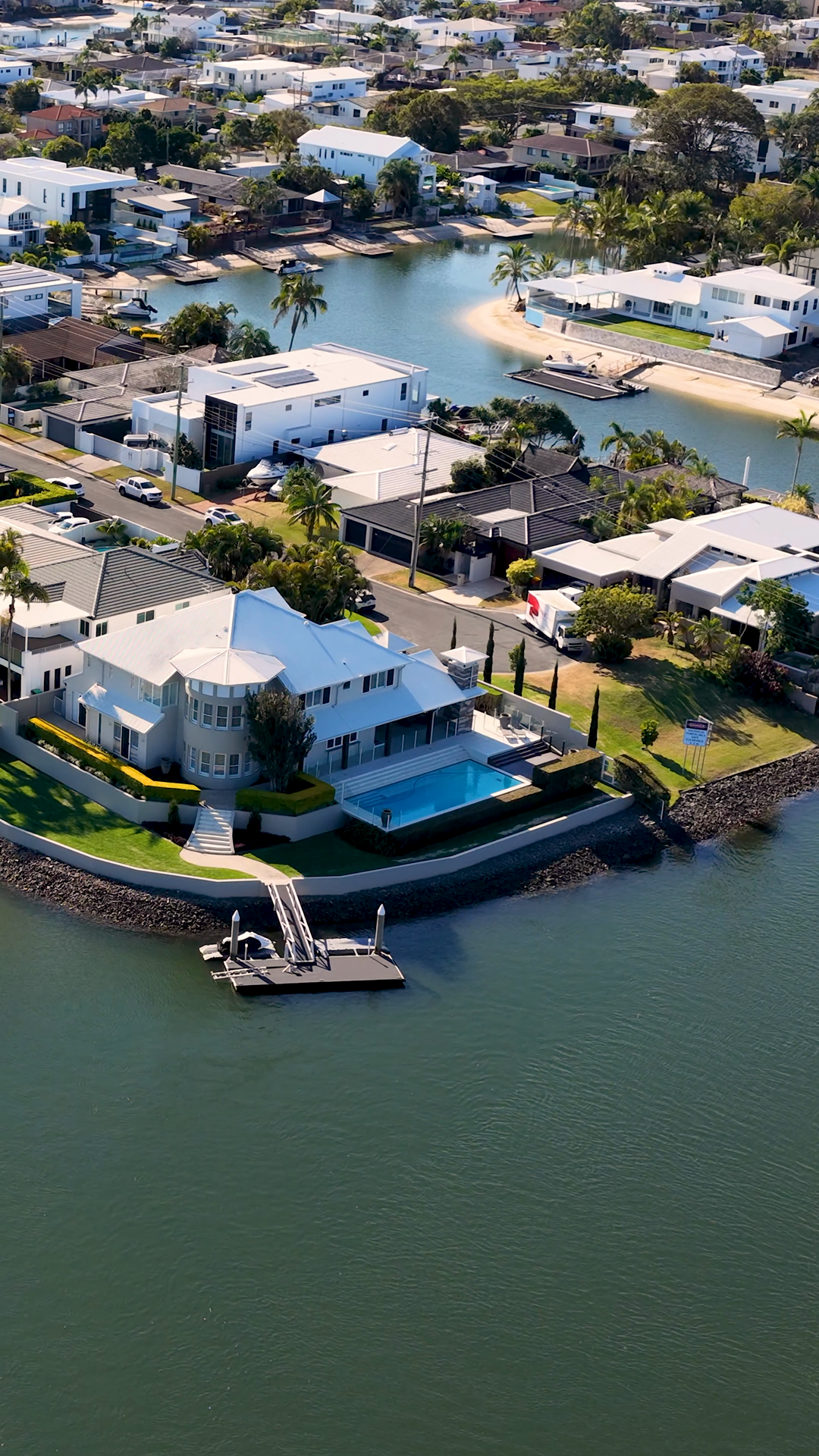 Aerial Flyover Of Riverside Homes Boats Gold Stock Footage SBV ...