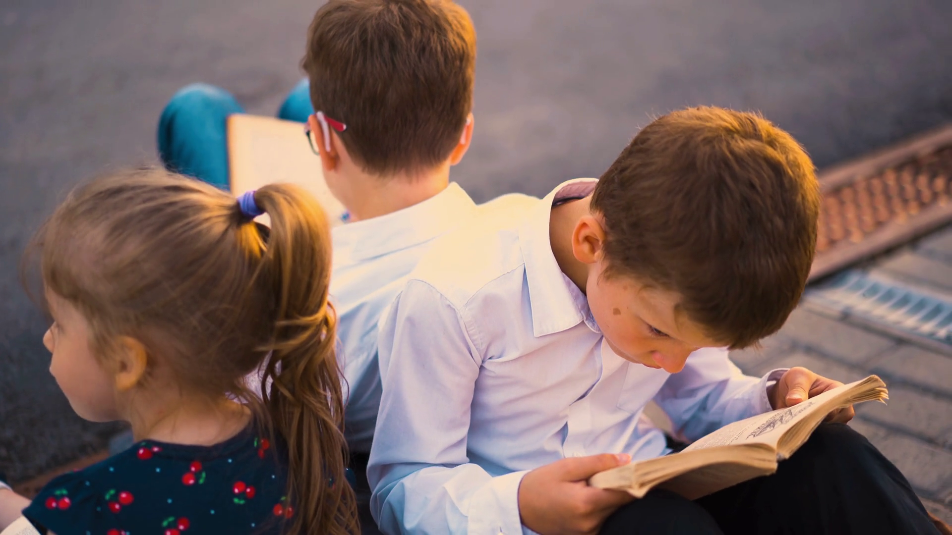 Student Brothers Reading Books On Pavement Stock Footage SBV-348631645 ...