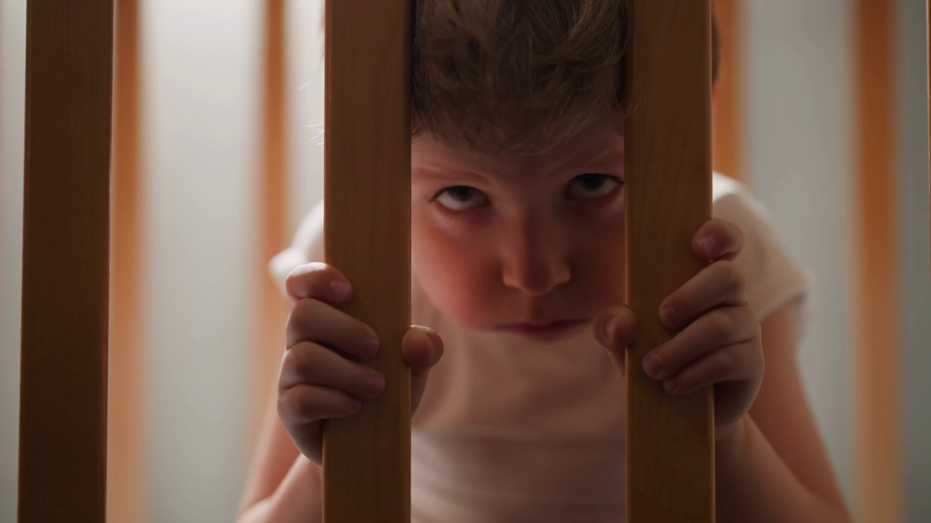 Concerned Child Peers Through Wooden Grid Of Stock Footage SBV ...