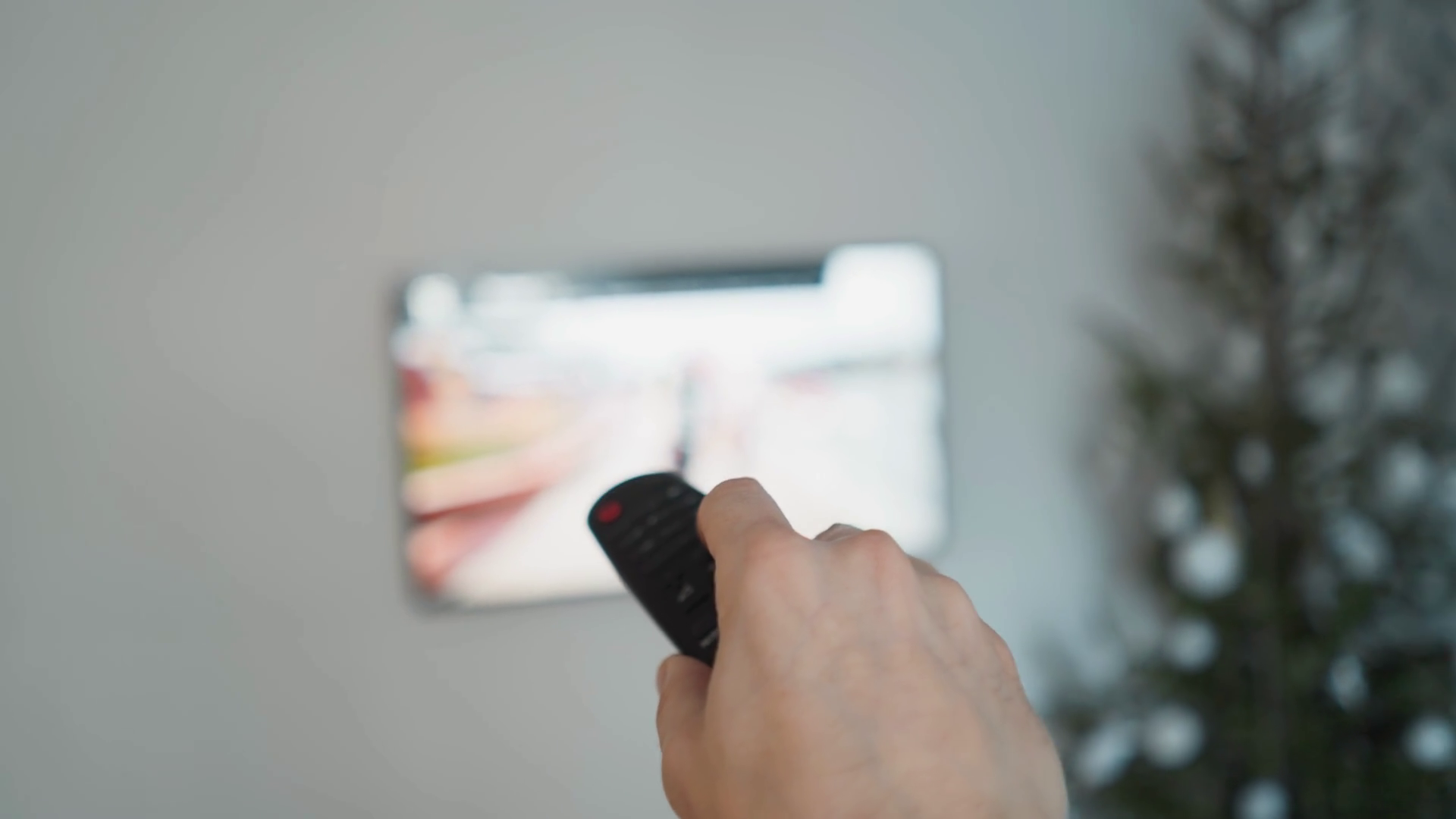 Hand Holding Remote Control In Front Of Tv Stock Footage SBV-348804204 ...