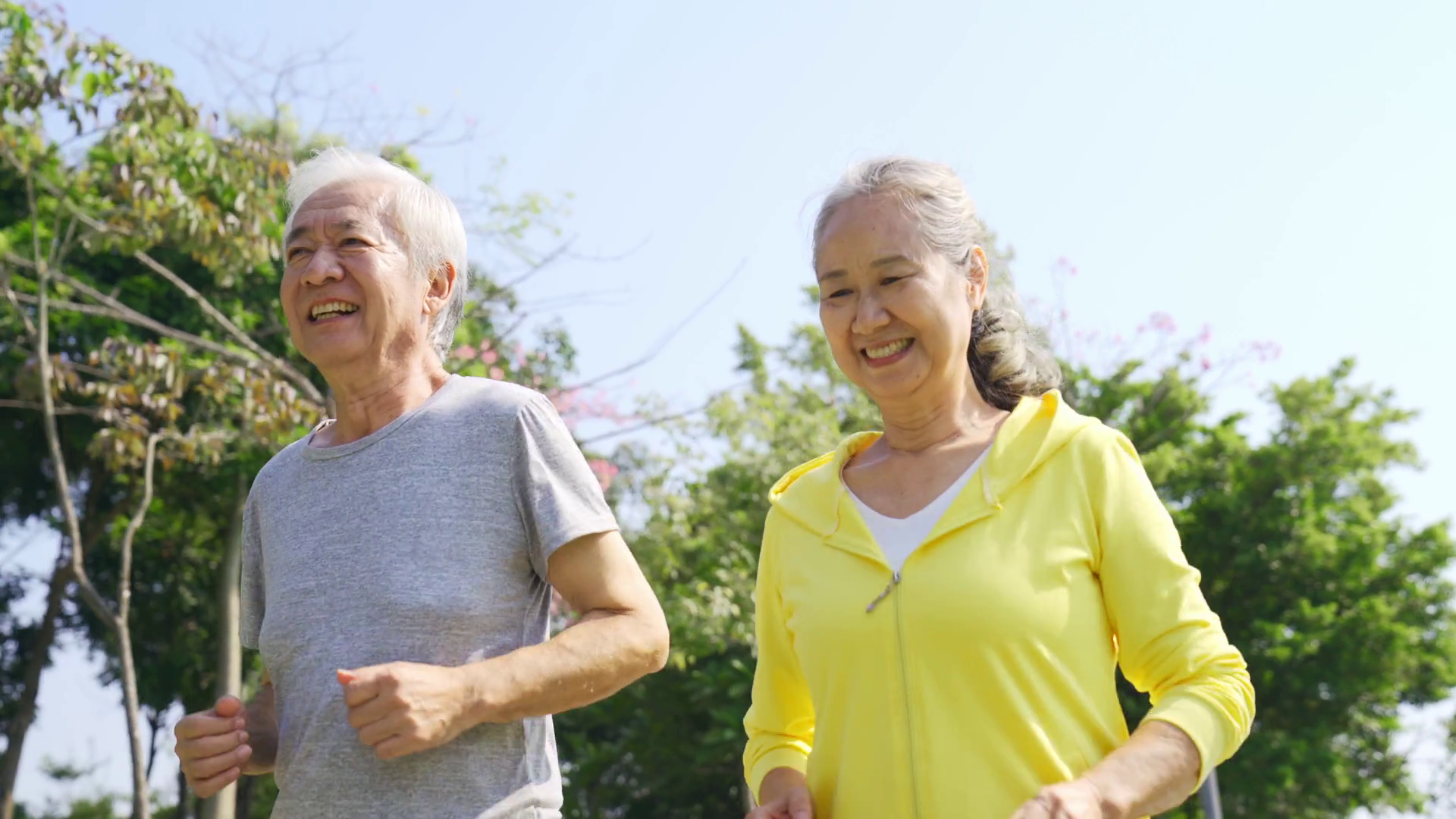 Happy Senior Asian Couple Jogging Outdoors Stock Footage SBV-347805287 ...
