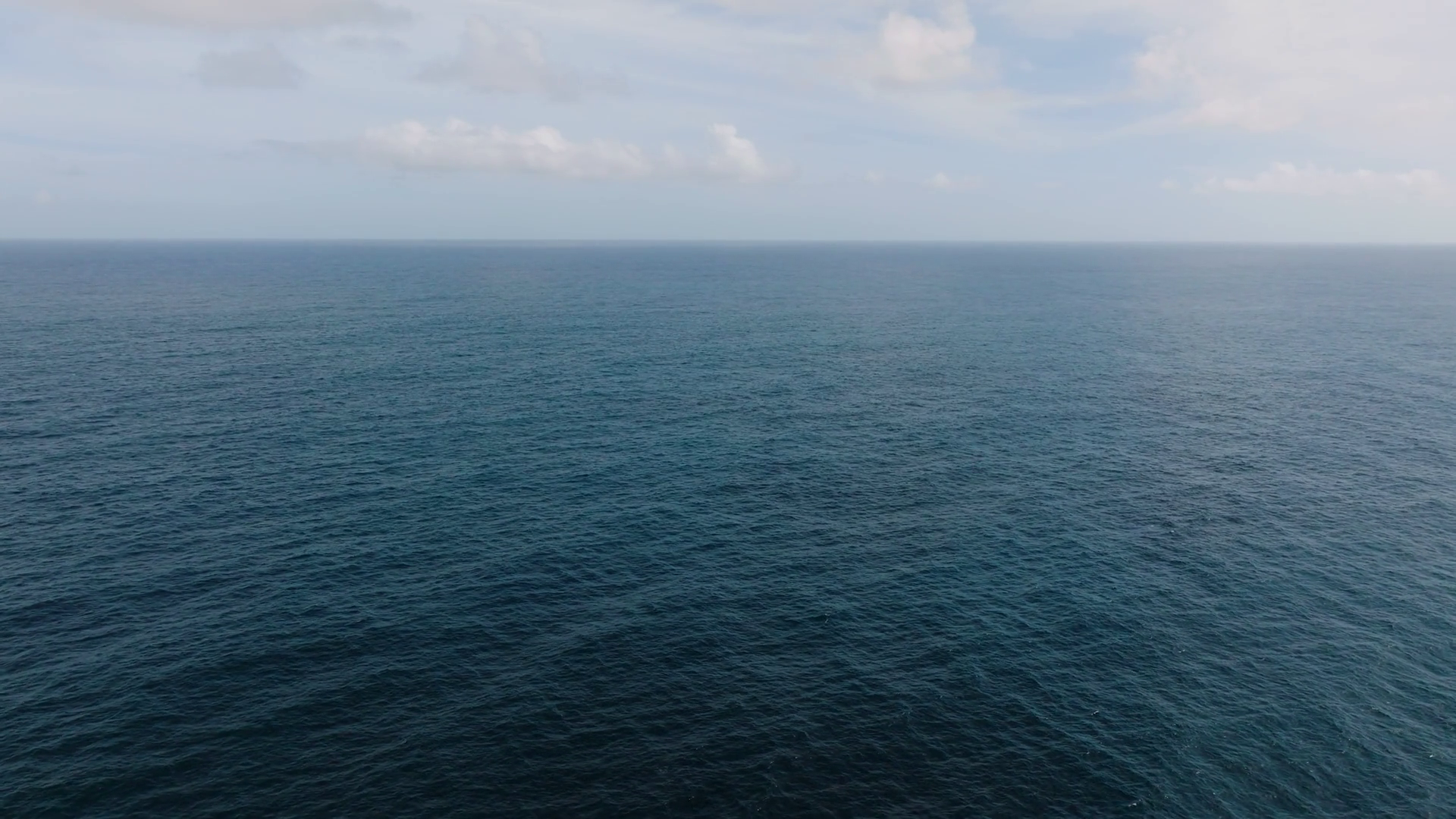 A Vast Expanse Of Deep Blue Ocean Stretches Stock Footage SBV-352229707 ...