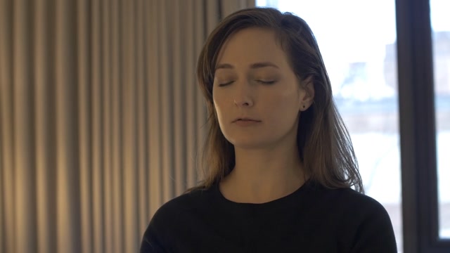 Videoblocks Pan Up To Woman Peacefully Meditating And Deep Breathing ...