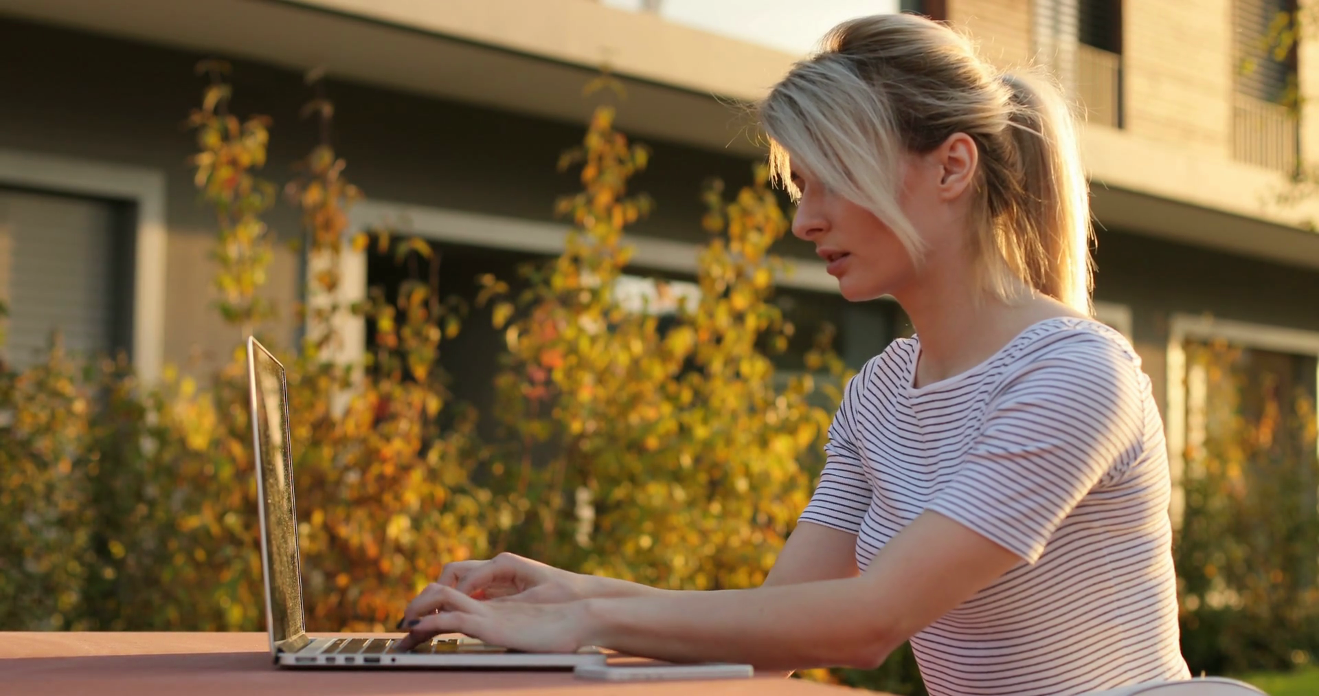 Young Woman Using Laptop Computer Outdoors Stock Footage SBV-319450160 ...