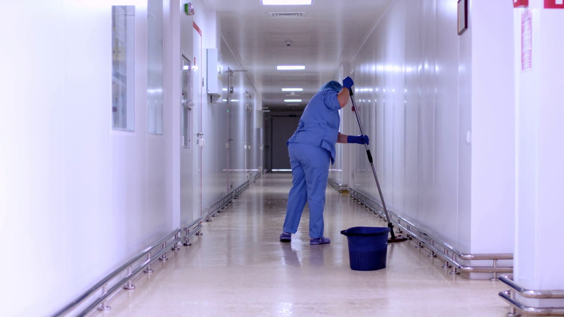 https://d2j2uxe7jasn0r.cloudfront.net/thumbnails/video/Vd3bj2jPe/videoblocks-factory-worker-mopping-floor-in-hospital-corridor-worker-cleaning-corridor-woman-in-uniform-cleaning-flour-in-empty-corridor-female-cleaner-mopping-floor-in-white-corridor-hospital_sxxvpoo-n_thumbnail-1080_07.png