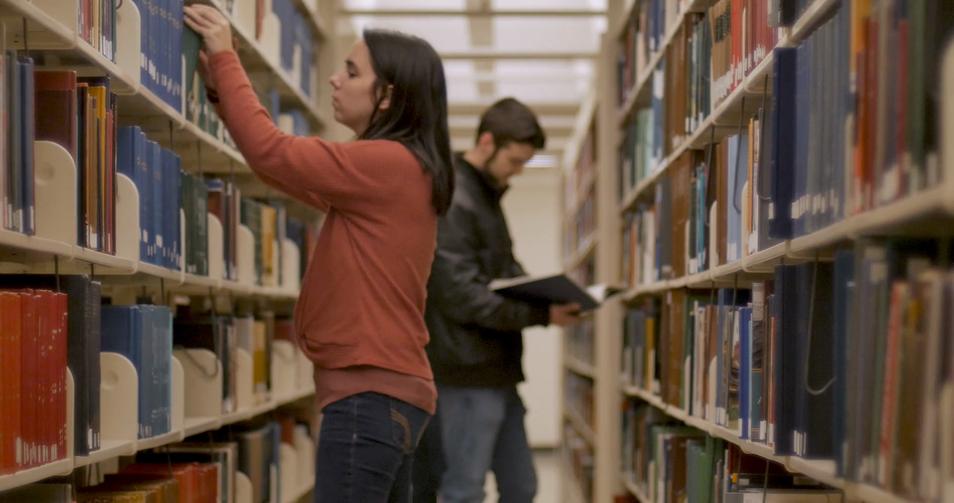 Young Individuals Exploring Books In Library Stock Footage SBV ...