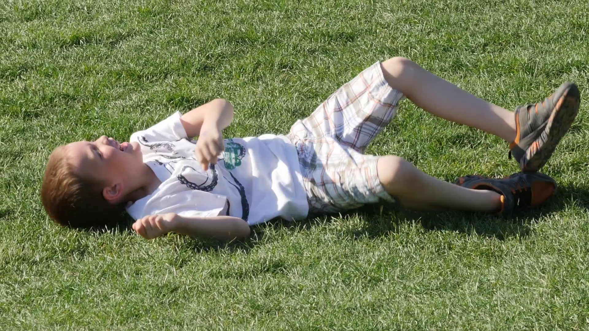Slow Motion Of Child Rolling Down Hill In Stock Footage SBV-337866636 ...