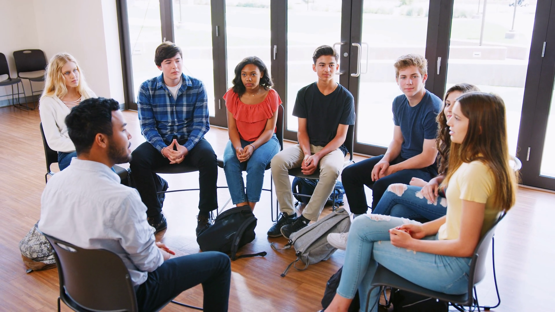 Male Tutor Leading Discussion Group Amongst Stock Footage SBV-327935439 ...