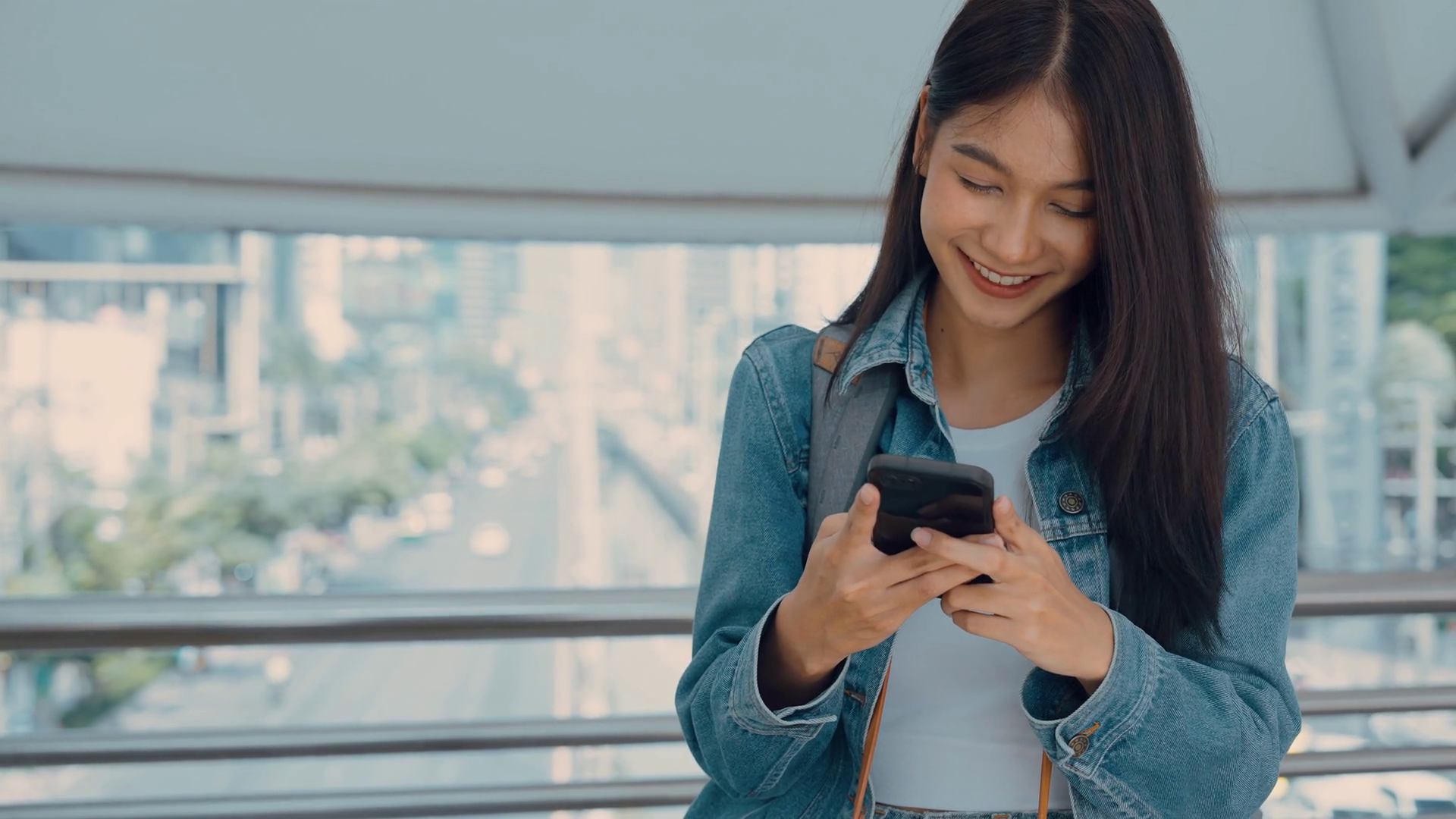 Young Asian Woman Smiling Using Mobile Phone Stock Footage SBV ...