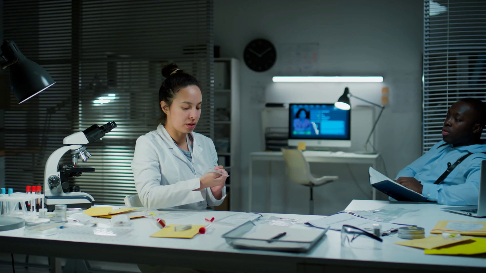 Female Forensic Scientist Sitting At Desk In Stock Footage SBV ...