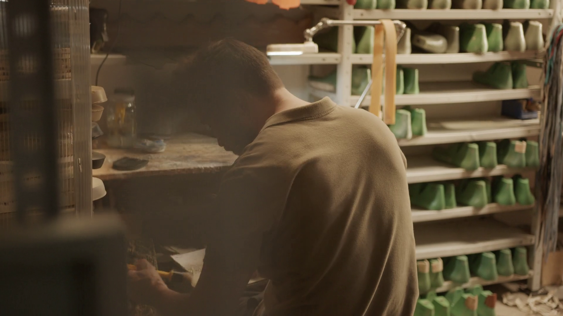 Back View Of Professional Shoemaker Sitting Stock Footage SBV-348798891 ...