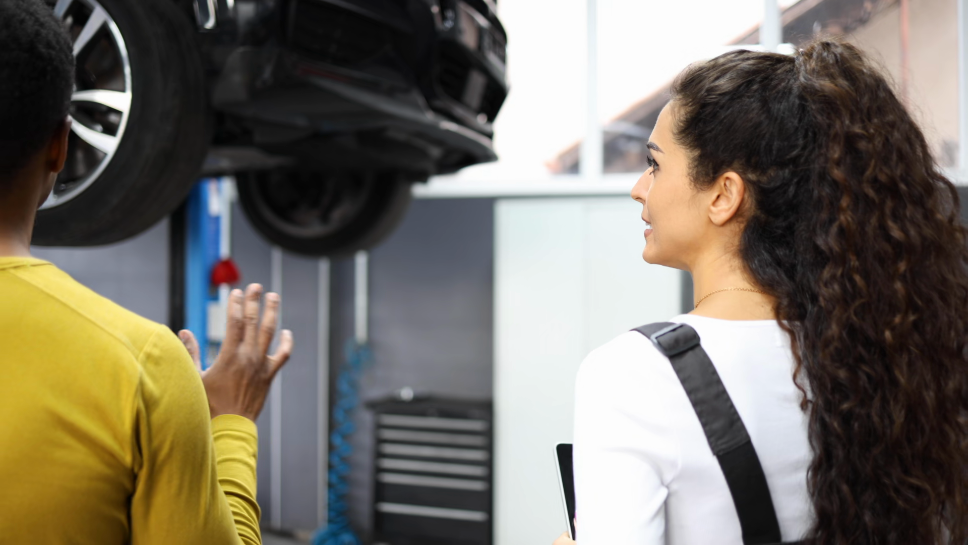 Female Car Mechanic Explaining Vehicle Stock Footage SBV-354051105 ...