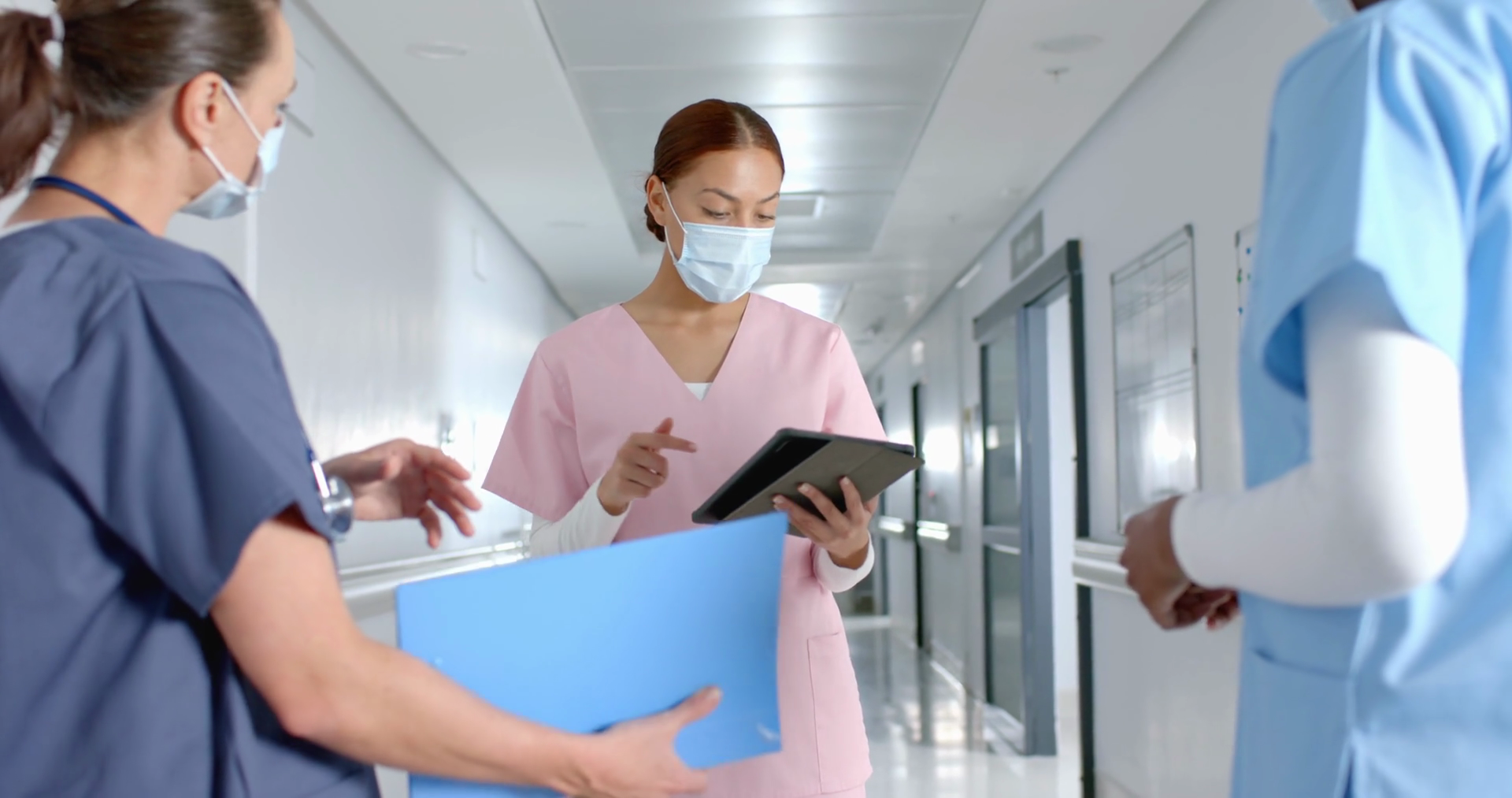 Diverse Doctors Discussing Work Using Tablet Stock Footage SBV ...